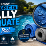 Magnifying glass showing water droplets on a blue pool cover fabric roll next to grey and tan rolls beside a swimming pool.